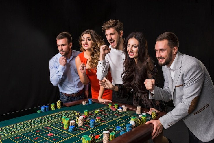 Antarmuka pemain Wild Coaster dengan panel kontrol taruhan, roda putaran, dan chat dealer di studio live